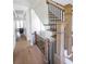 Staircase with wood railing and black spindles leading to the upper level at 1415 Coretta Bnd, Atlanta, GA 30318
