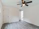 White bedroom featuring a ceiling fan, closet, and doorway leading to the bathroom at 1482 Connally Sw Ave, Atlanta, GA 30310