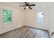 Bright bedroom featuring a ceiling fan and two windows offering natural light at 1482 Connally Sw Ave, Atlanta, GA 30310