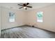 Spacious bedroom featuring a ceiling fan and dual windows providing lots of natural light at 1482 Connally Sw Ave, Atlanta, GA 30310