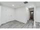 White hallway with gray wood-look floors, and doorways leading to various rooms at 1482 Connally Sw Ave, Atlanta, GA 30310