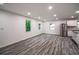 Spacious kitchen with white cabinets, stainless steel appliances, wood floors, and ample natural light at 1482 Connally Sw Ave, Atlanta, GA 30310