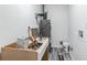 Utility room with water heater, and a new cabinet perfect for storage at 1482 Connally Sw Ave, Atlanta, GA 30310