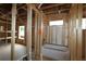 Bathroom framing showcases the tub placement along with plumbing and electrical at 251 Strawberry Ln, Woodstock, GA 30189