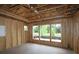 Interior framing of a room showcasing wall and ceiling construction; windows offering natural light at 251 Strawberry Ln, Woodstock, GA 30189