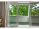 View of a balcony with white railing and green trees outside at 872 Euclid Ne Ave, Atlanta, GA 30307