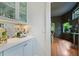 Chic bar area with custom cabinets, marble countertops, and stylish decor at 872 Euclid Ne Ave, Atlanta, GA 30307