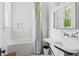 Classic bathroom featuring subway tile, a soaking tub, and a vintage-style sink for a timeless appeal at 872 Euclid Ne Ave, Atlanta, GA 30307