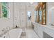 Elegant bathroom featuring a soaking tub and a tiled walk-in shower at 872 Euclid Ne Ave, Atlanta, GA 30307