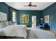 Bedroom with art, blue walls, and views to the ensuite bathroom at 872 Euclid Ne Ave, Atlanta, GA 30307