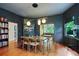 Elegant dining room with a bookshelf and hardwood floors, open to the living room, creating a seamless flow at 872 Euclid Ne Ave, Atlanta, GA 30307
