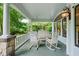 Charming front porch with rocking chairs and swing, perfect for relaxing outdoors at 872 Euclid Ne Ave, Atlanta, GA 30307