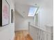 Bright hallway with hardwood floors, skylight, and white walls, offering a modern and airy feel at 872 Euclid Ne Ave, Atlanta, GA 30307