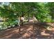 Wooden sign for Inman Park, a city of Atlanta county park, surrounded by lush greenery at 872 Euclid Ne Ave, Atlanta, GA 30307