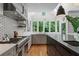Elegant kitchen with stainless steel appliances, custom cabinets, and a spacious layout at 872 Euclid Ne Ave, Atlanta, GA 30307