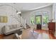 Bright living room featuring a decorative staircase and hardwood floors, creating an inviting atmosphere at 872 Euclid Ne Ave, Atlanta, GA 30307