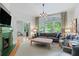 Elegant living room featuring a fireplace, large windows, and stylish decor, creating a welcoming atmosphere at 872 Euclid Ne Ave, Atlanta, GA 30307