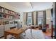 Well-lit home office featuring built-in bookshelves and a spacious work area at 872 Euclid Ne Ave, Atlanta, GA 30307