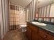 Bathroom with shower/tub combo and single vanity with storage space at 148 Boogers Hill Rd, Oxford, GA 30054