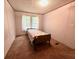 Bedroom with carpet, bright windows, and white walls provides a cozy and peaceful space at 148 Boogers Hill Rd, Oxford, GA 30054