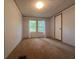 Bedroom with carpet, bright windows, and white walls provides a cozy and peaceful space at 148 Boogers Hill Rd, Oxford, GA 30054