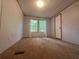 Bedroom with carpet, bright windows, and white walls provides a cozy and peaceful space at 148 Boogers Hill Rd, Oxford, GA 30054