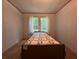 Bedroom with carpet, bright windows, and white walls provides a cozy and peaceful space at 148 Boogers Hill Rd, Oxford, GA 30054