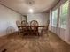 Warm dining room featuring a wooden dining set, neutral walls, and natural light, ideal for Gathering meals at 148 Boogers Hill Rd, Oxford, GA 30054