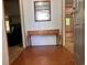 Inviting entryway with hardwood flooring, a decorative table and mirror, leading into the home's living spaces at 148 Boogers Hill Rd, Oxford, GA 30054