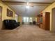 Large living room with comfortable seating, built-in shelving, and windows that let in natural light, creating a cozy atmosphere at 148 Boogers Hill Rd, Oxford, GA 30054