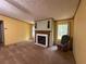 Bright living room featuring a fireplace with white tile surround and ample space for seating, perfect for gatherings at 148 Boogers Hill Rd, Oxford, GA 30054