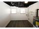 Unfinished basement with an exposed ceiling, hot water heater and laminate flooring at 1616 W Kellogg Cir, Douglasville, GA 30134