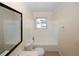 Bright bathroom with large mirror, tub/shower combo and window at 1616 W Kellogg Cir, Douglasville, GA 30134