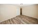 This bedroom features wood flooring and a double door closet for ample storage at 1616 W Kellogg Cir, Douglasville, GA 30134