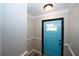 Close up of the light blue front door with trim and a view into the entryway at 1616 W Kellogg Cir, Douglasville, GA 30134