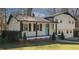 Inviting home featuring a covered front porch and landscaped front yard at 1616 W Kellogg Cir, Douglasville, GA 30134