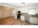 Updated kitchen with stainless appliances, granite counters and open access to living room at 1616 W Kellogg Cir, Douglasville, GA 30134