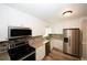 Bright kitchen features granite countertops, stainless steel appliances, and subway tile backsplash at 1616 W Kellogg Cir, Douglasville, GA 30134