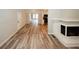 Open-concept living room showcasing hardwood floors, a fireplace, and natural light at 1616 W Kellogg Cir, Douglasville, GA 30134