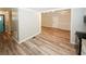 Open floor plan into the living room from kitchen with wood flooring at 1616 W Kellogg Cir, Douglasville, GA 30134