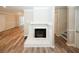 Open-concept living room with a fireplace, hardwood floors, and plenty of space at 1616 W Kellogg Cir, Douglasville, GA 30134