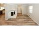 Spacious living room with hardwood floors, fireplace, and large windows for natural light at 1616 W Kellogg Cir, Douglasville, GA 30134