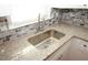Close up of the kitchen sink, granite counters and subway tile backsplash at 1616 W Kellogg Cir, Douglasville, GA 30134