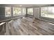 Light-filled sunroom with multiple windows and hardwood floors at 1616 W Kellogg Cir, Douglasville, GA 30134
