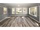 Bright sunroom with hardwood floors and multiple windows offers relaxing space at 1616 W Kellogg Cir, Douglasville, GA 30134