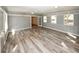 Large sunroom features hardwood floors, brick accents, and access to backyard at 1616 W Kellogg Cir, Douglasville, GA 30134
