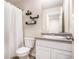 Bright bathroom features a single sink vanity, matching shelves and a shower with white curtain at 3565 Brycewood Dr, Decatur, GA 30034