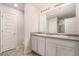 Bright bathroom with dual sink vanity, modern lighting, and separate shower at 3565 Brycewood Dr, Decatur, GA 30034