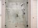 Beautiful bathroom with a modern glass enclosed shower and a marble tile design at 3565 Brycewood Dr, Decatur, GA 30034
