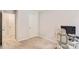 This carpeted bedroom features neutral walls, a white door, and a desk area with a computer setup at 3565 Brycewood Dr, Decatur, GA 30034